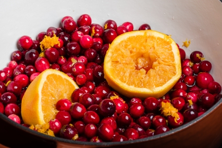 Cranberries and orange for making homemade cranberry sauceの写真素材
