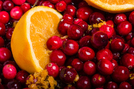 Cranberries and orange for making homemade cranberry sauceの写真素材