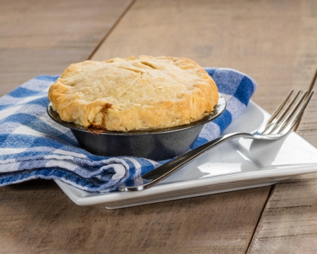 Homemade turkey pot pie on a white plateの写真素材
