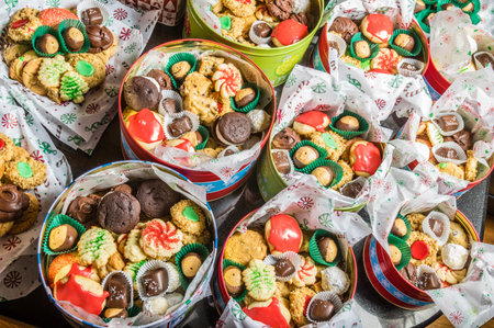 Tin boxes of baked cookies and candies for holiday