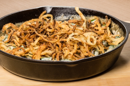 Fried onions cooking in a cast iron skilletの写真素材