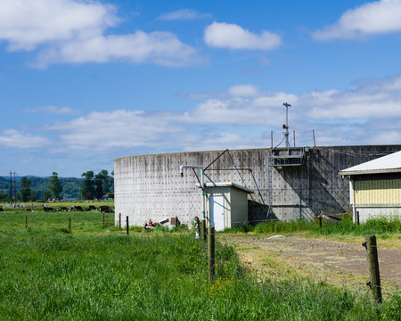 A concrete storage tank for liquid manure on a farmの写真素材