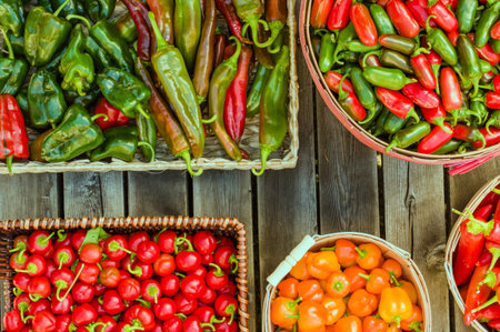 Display of assorted peppers in baskets