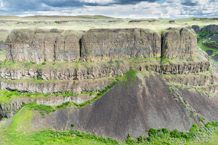 Steep vertical cliffs along a river canyonの写真素材