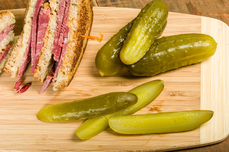 Grilled reuben sandwich with dill pickle spearsの写真素材