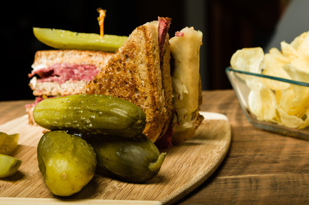 Grilled reuben sandwich with dill pickle spearsの写真素材