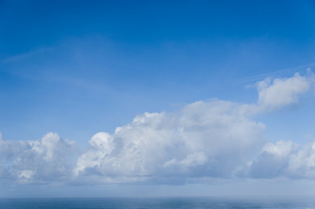 White clouds on a dark blue skyの写真素材