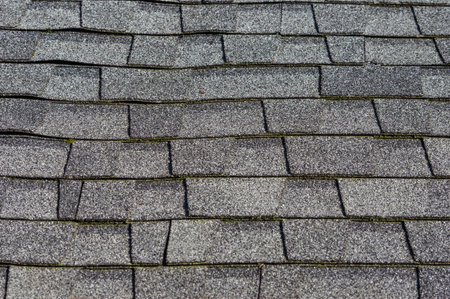 Detail and texture of composition shingles on a roof