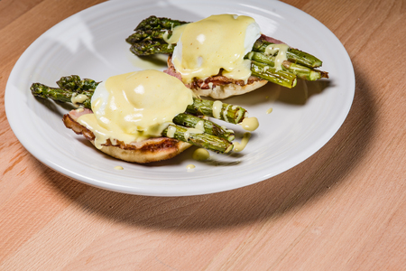 Poached egg sandwhich with asparagus on English muffinの写真素材