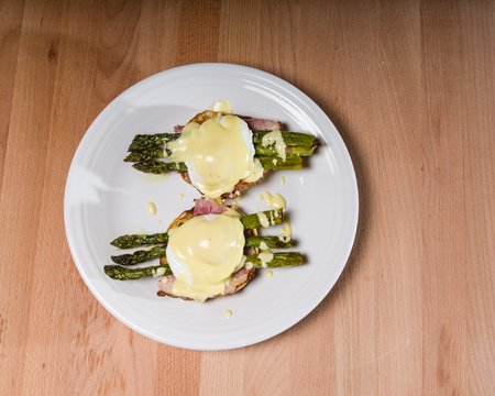 Poached egg sandwhich with asparagus on English muffinの写真素材