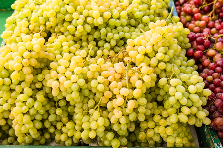Fresh yellow grapes at the farmers marketの写真素材