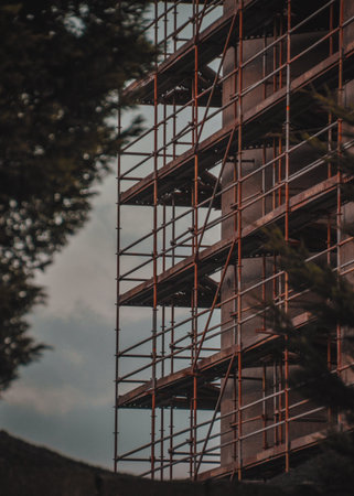 Architectural detail of a building under construction with scaffolding.