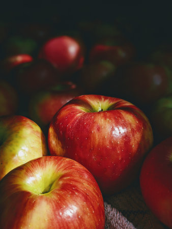 Red apples on a wooden table. Selective focus. Toned.の写真素材