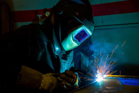 welder, craftsman, erecting technical steel Industrial steel welder in factory