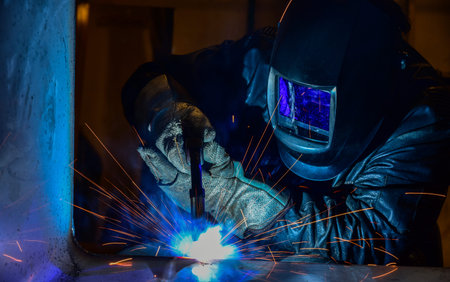 welder Industrial automotive part in factory Welder at work welding splatter