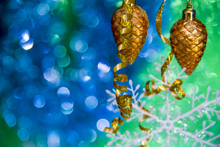 Christmas star closeup and baubles on blue blurred background Christmas toy on a blue background.の写真素材