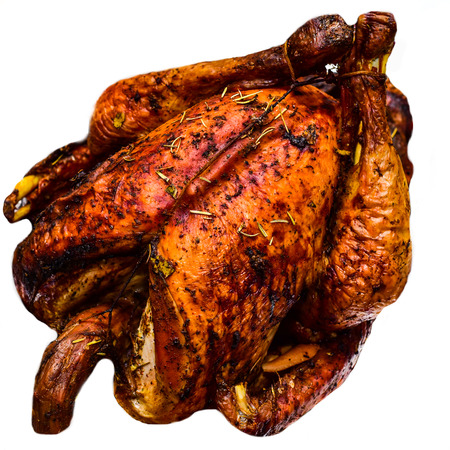 Whole roasted chicken isolated on white turkey cooked in the oven isolatedの写真素材