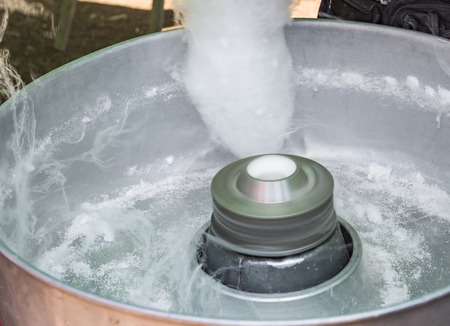 Candy floss machine with white candyfloss Cotton candy makingの写真素材