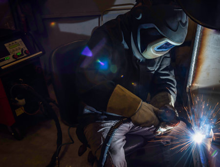welder, craftsman, erecting technical steel Industrial steel welder in factory