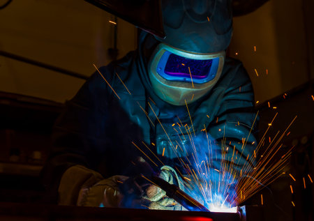 welder, craftsman, erecting technical steel Industrial steel welder in factory