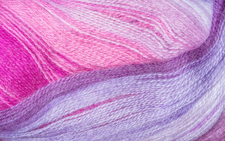 A super close up image of amethyst yarn Background of purple yarn, knitting Lilac, pinkwoolen thread