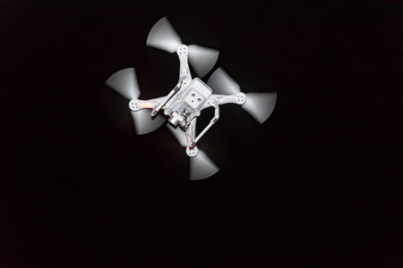 Quadrocopter on a black background at the bottom.