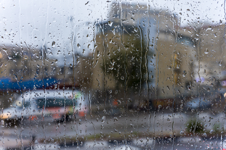 Rainy days,Rain drops on window,rainy weather,rain background,rain and bokeh Rain on the weather window.の写真素材