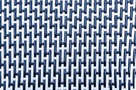 Plastic fabrics background. Fiber material. Extreme macro. Background black plastic weave.の写真素材