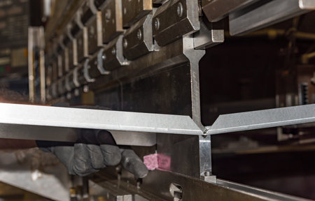operator bending metal sheet by sheet bending machine bending of metalの写真素材