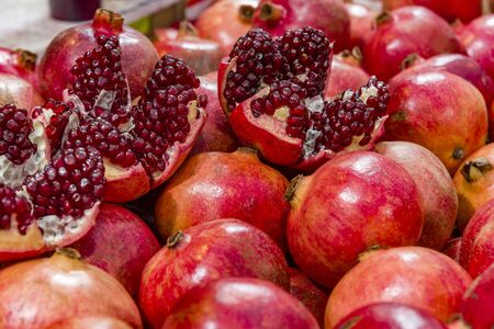 Cut and whole pomegranate fruit whole and choppedの写真素材