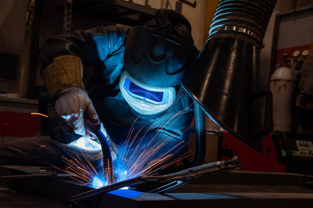 welder is welding metal part in car factory, welding, welding work, welder.