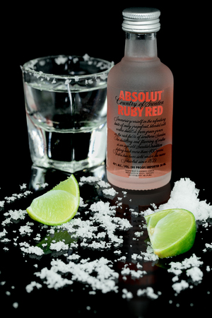 Absolut Vodka Vanilia with lemon and salt, black backdropのeditorial素材