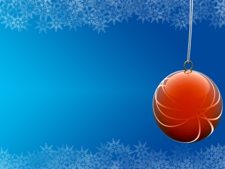 red ball on blue background with snowflake bordersの写真素材