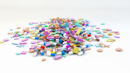 Colorful tablets with capsules and pills on white backgroundの写真素材