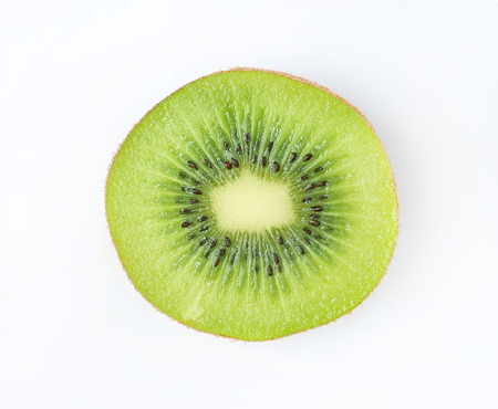 Slice of juicy kiwi fruit isolated on white backgroundの写真素材