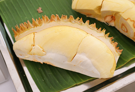 durain, southeast asia summer fruit on banana leaf
