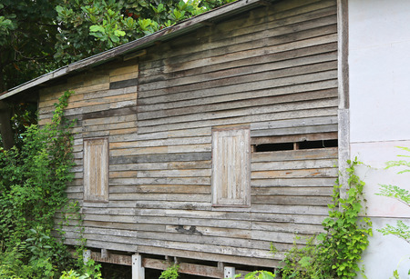 Old abandoned wooden house with brokenの写真素材