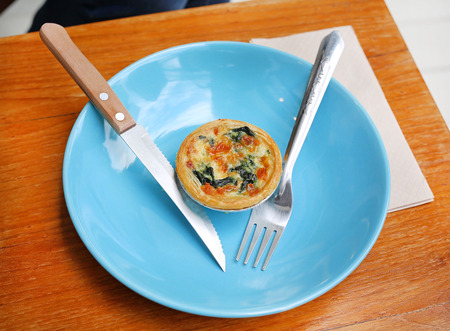 Turkish flat bread with cheese and spinach topping served on a plate. Food backgroundの写真素材