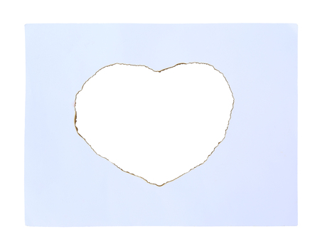 Paper sheet with Burning in shape of heartの写真素材