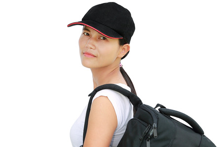 Asian girl with bag going on a journey on white backgroundの写真素材