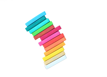 Blank white blackboard with colorful chalk on wooden plank.の写真素材