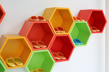 Colorful Modern Shoe Rack on the white wall.の写真素材