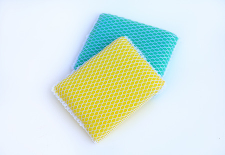 multi-colorful kitchen sponges for ware washing on white background