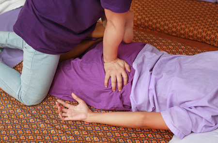 Thai massage alternative medicine therapy with Thai herb aroma oil ,Spa or alternative medical therapy concept.の写真素材