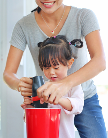 Mother and child making Homemade pancakeの写真素材