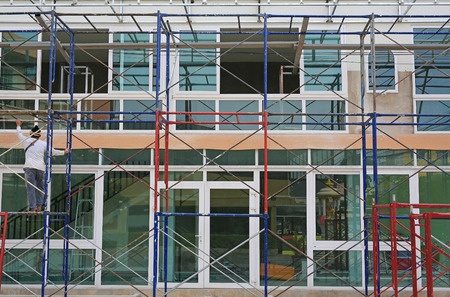 Building under construction with scaffolding.の写真素材