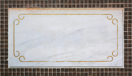 Empty blank marble label on tile wall.の写真素材
