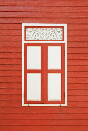 Retro style wall wood plank house with windowsの写真素材