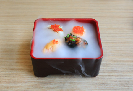 Nami sushi set served with cold smoked on wooden table. Traditional Japanese food.の写真素材