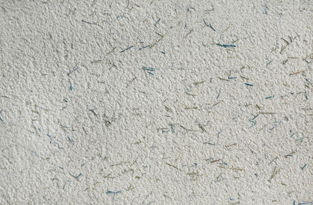 Abstract cement texture mixed with grass backgroundの写真素材